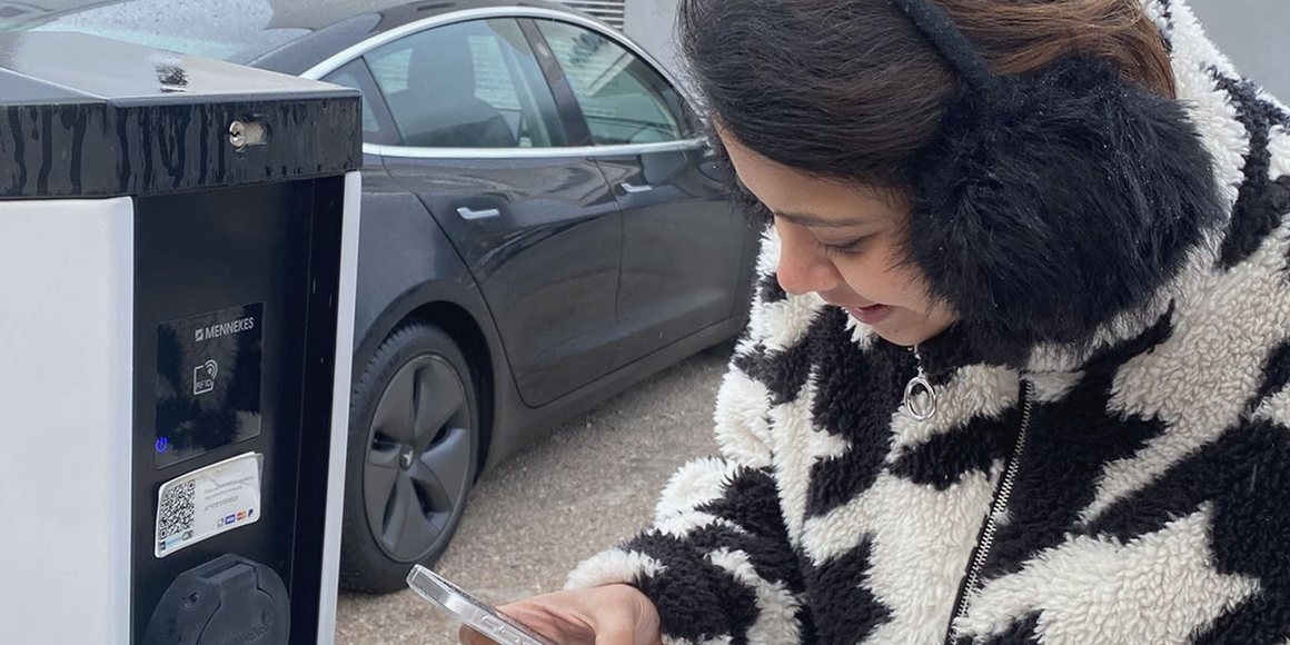 Seema Jain testing the installer app at a charging station on site